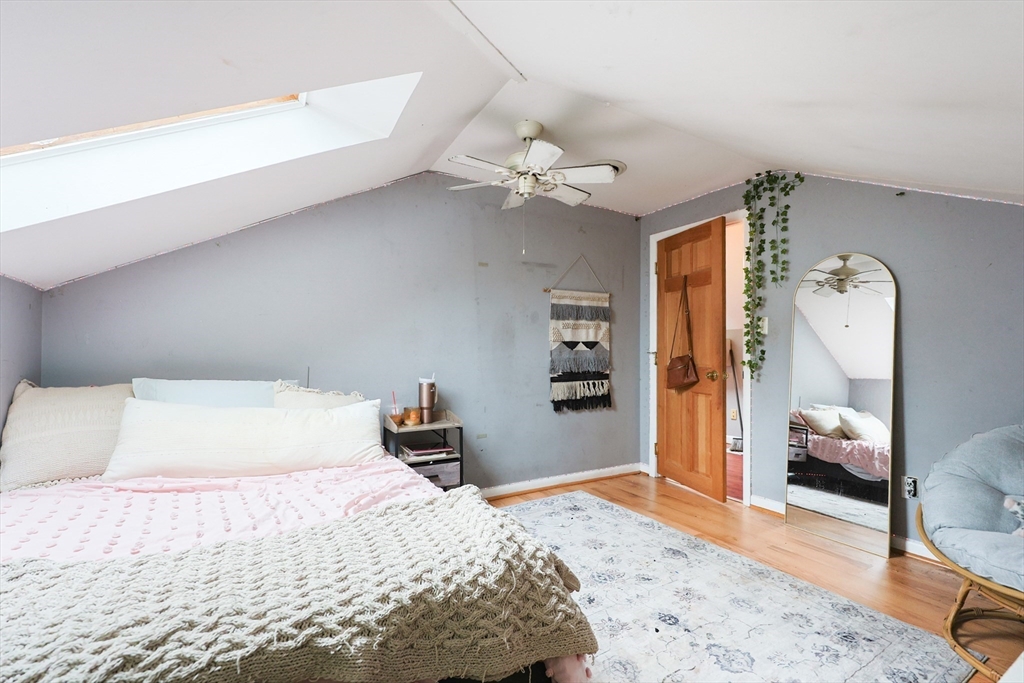 273 Tremont Street Fall River, MA 02720 - Photo 28 of 37 a bedroom with a bed dresser and a window