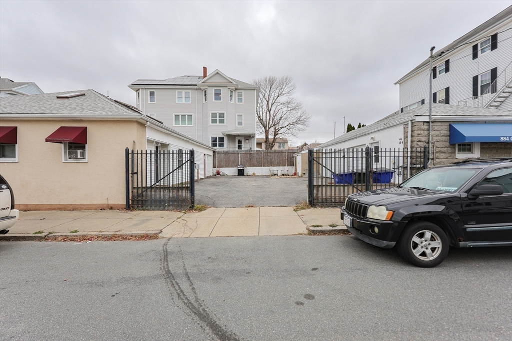 273 Tremont Street Fall River, MA 02720 - Photo 3 of 37 a car parked in front of house