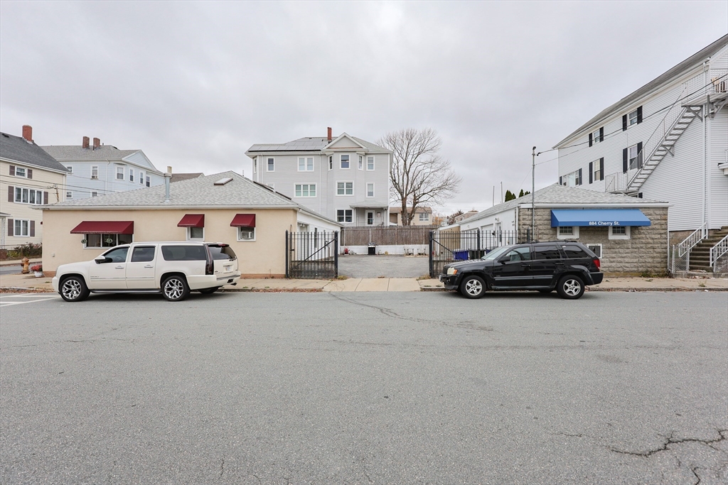 273 Tremont Street Fall River, MA 02720 - Photo 36 of 37 a view of a cars park in front of a building