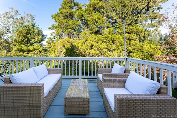 a bedroom with a bed and large windows