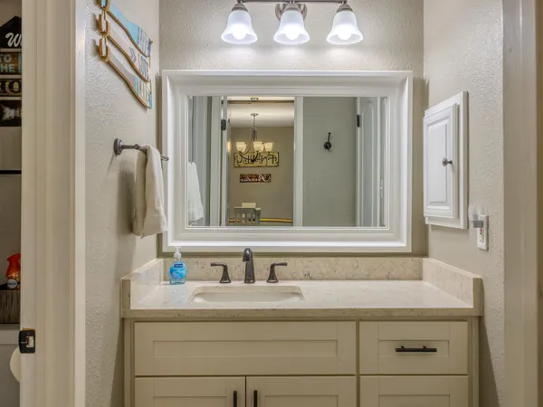 a bathroom with a sink and a mirror