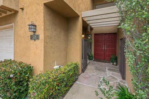 a view of a pathway of the house and front door