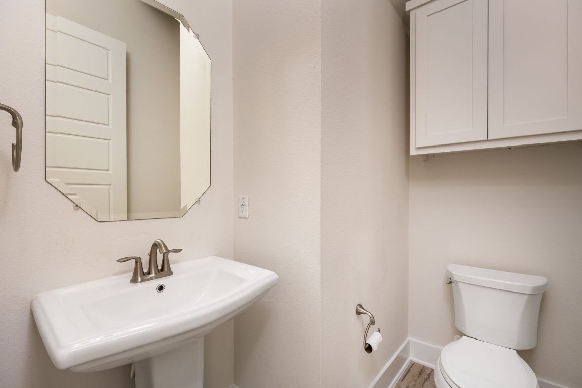2401 McBee Street Austin, TX 78723 - Photo 16 of 36 Bathroom featuring toilet and a sink