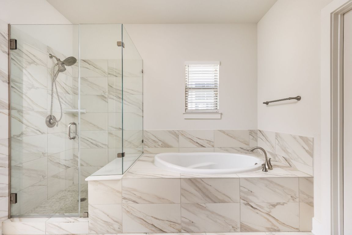 2401 McBee Street Austin, TX 78723 - Photo 24 of 36 Full bathroom with a garden tub and a marble finish shower