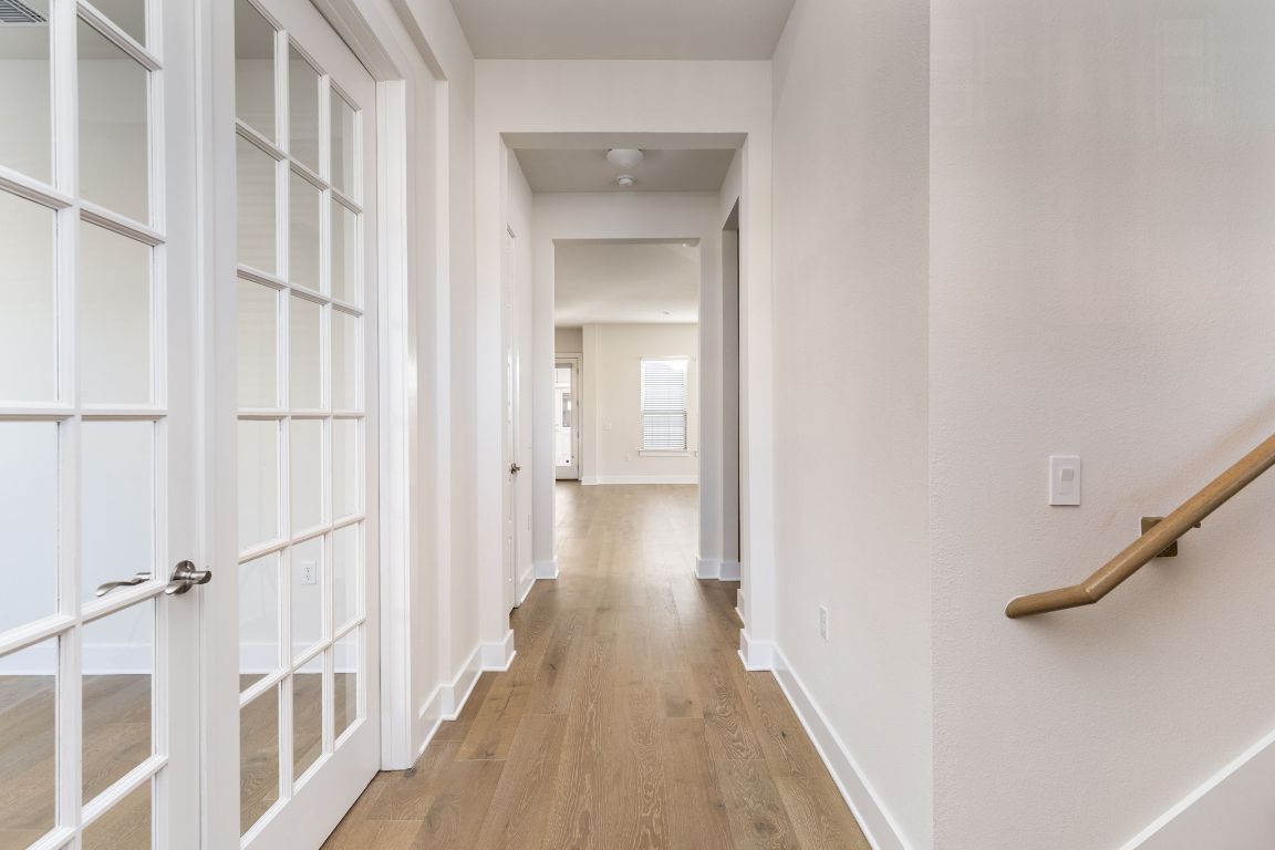 2401 McBee Street Austin, TX 78723 - Photo 3 of 36 Corridor with light wood finished floors and baseboards