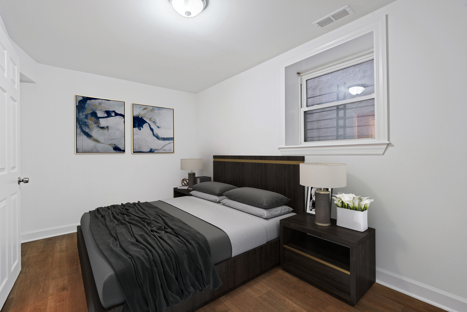 1734 West Erie Street, Unit G Chicago, IL 60622 - Photo 12 of 18 a bedroom with a bed and a painting on the wall