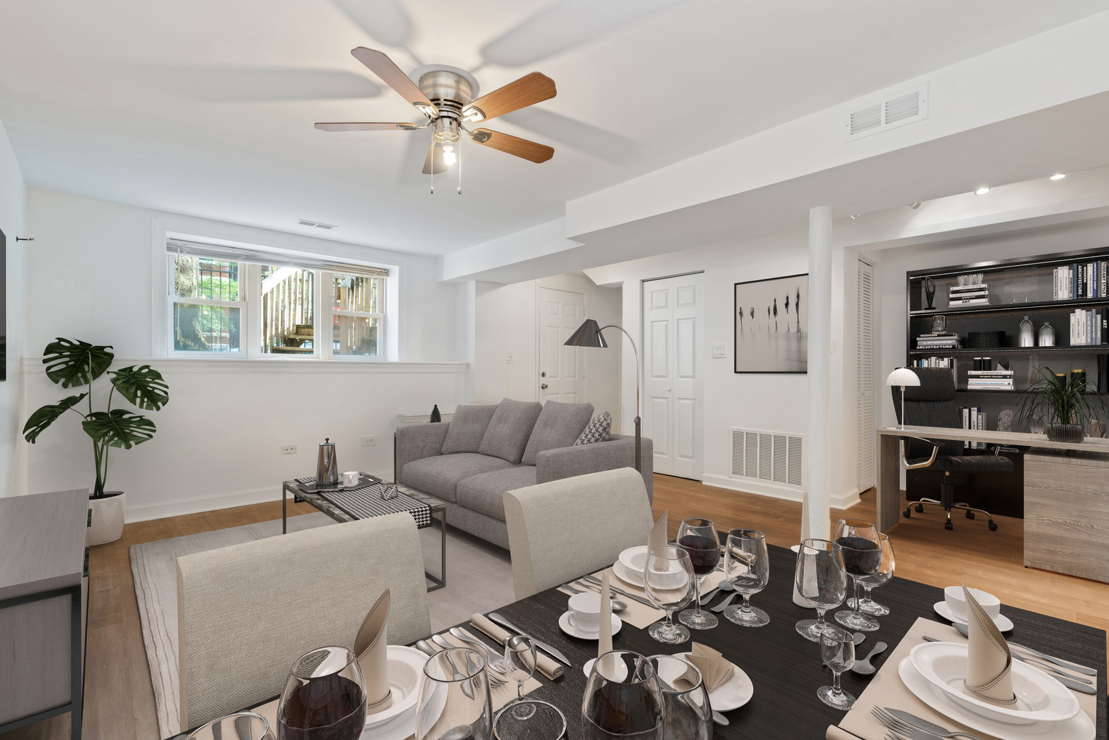 1734 West Erie Street, Unit G Chicago, IL 60622 - Photo 4 of 18 a living room with furniture and a large window