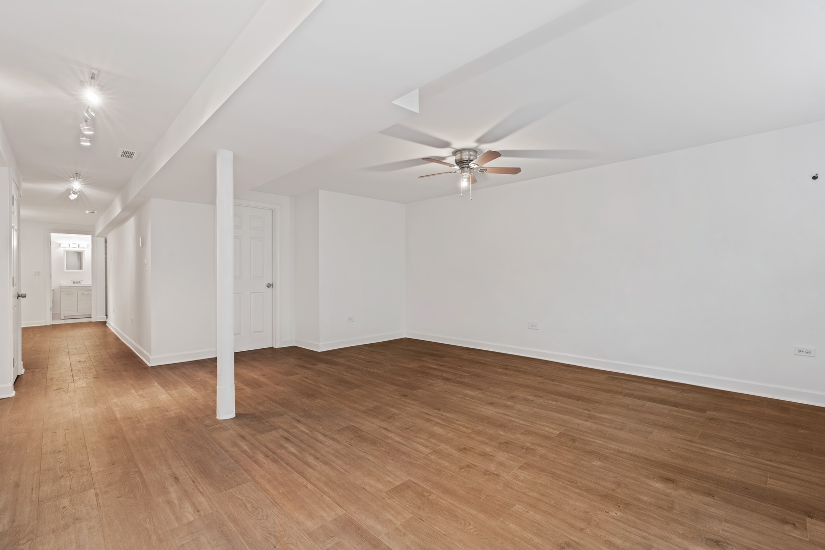 1734 West Erie Street, Unit G Chicago, IL 60622 - Photo 8 of 18 a view of a room with wooden floor