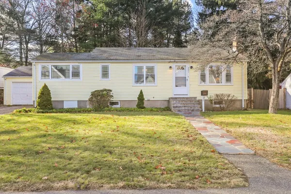 a front view of house with outdoor seating