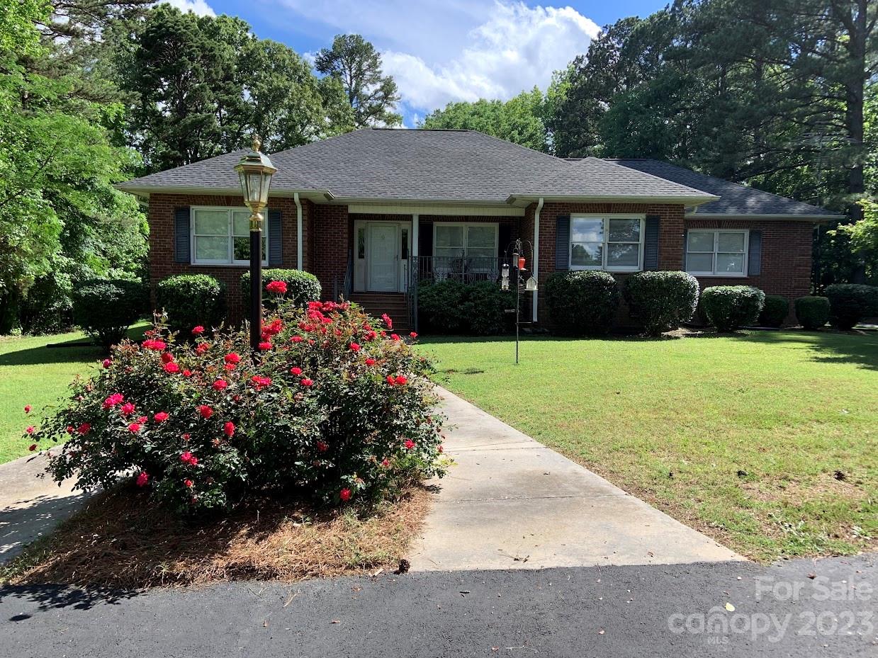 2403 Pinckney Road Chester, SC 29706 - Photo 1 of 19 a front view of a house with a yard and garage