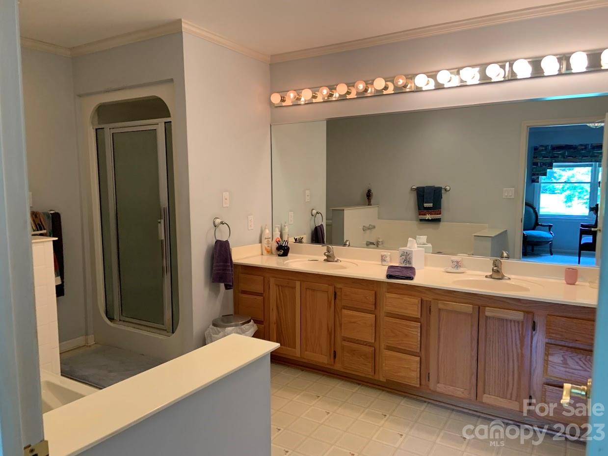 2403 Pinckney Road Chester, SC 29706 - Photo 11 of 19 a bathroom with a double vanity sink and mirror