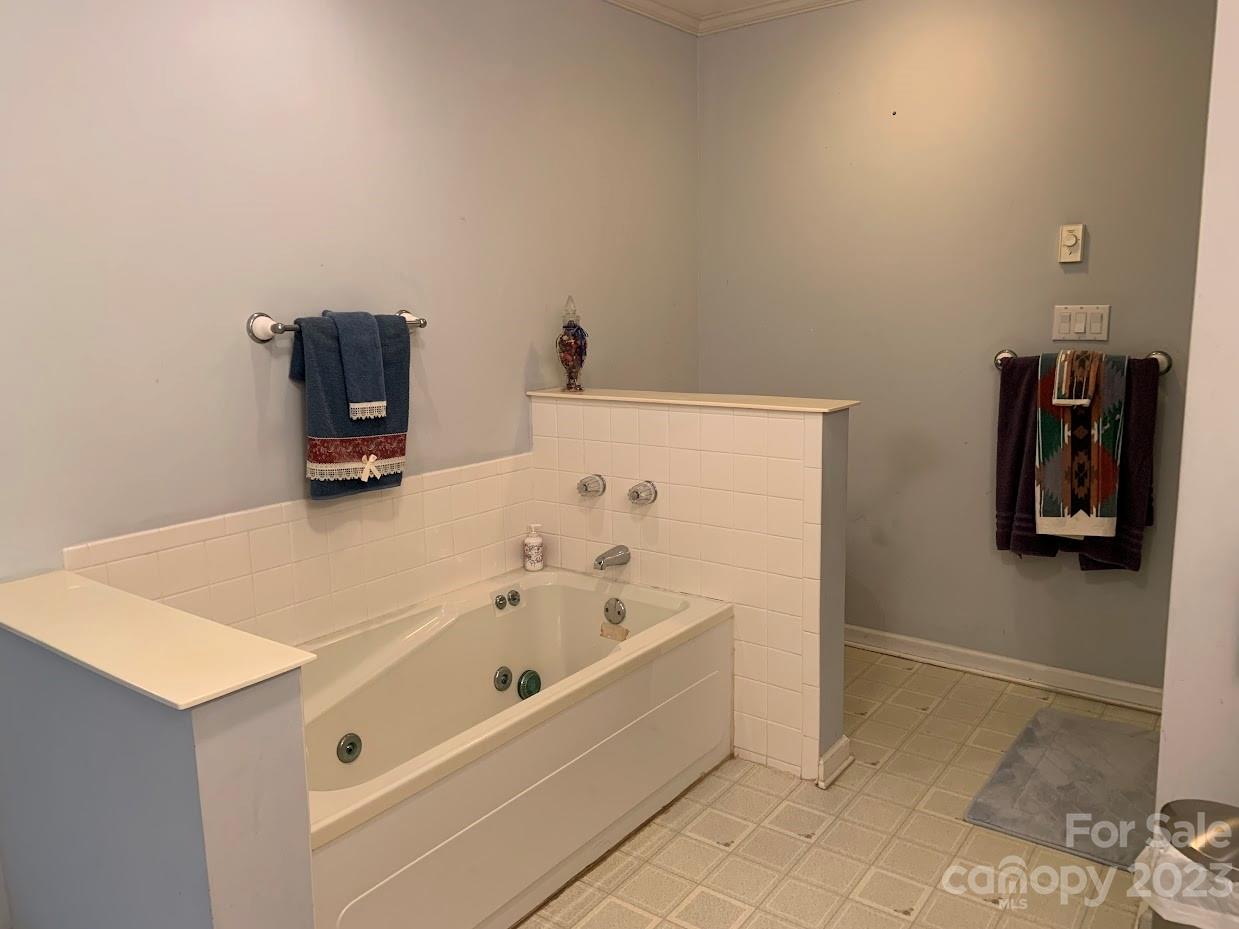 2403 Pinckney Road Chester, SC 29706 - Photo 12 of 19 a bathroom with a bathtub and a shower