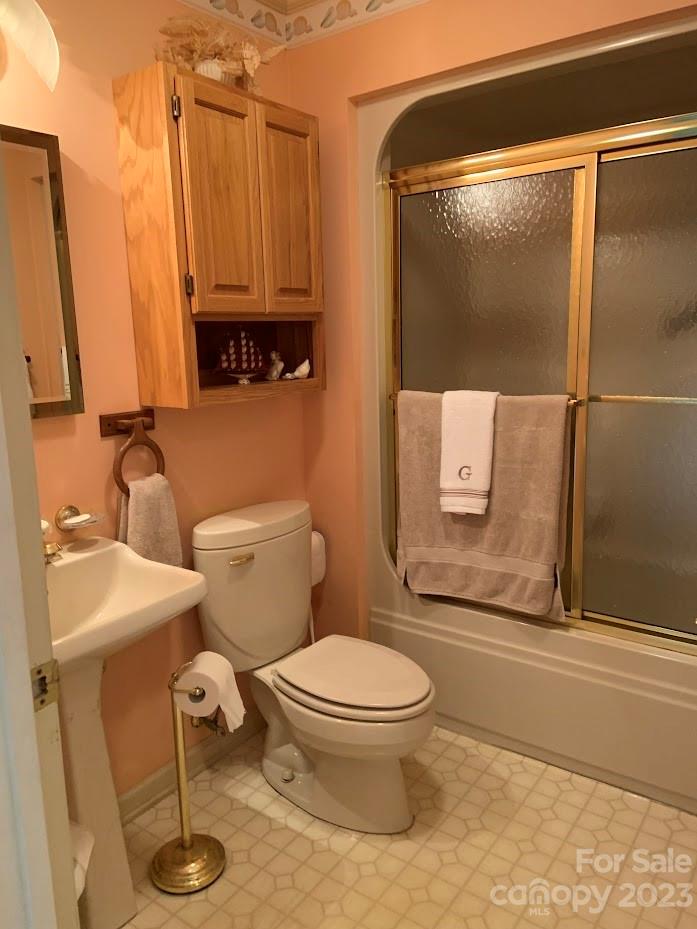 2403 Pinckney Road Chester, SC 29706 - Photo 15 of 19 a bathroom with a toilet a sink and shower