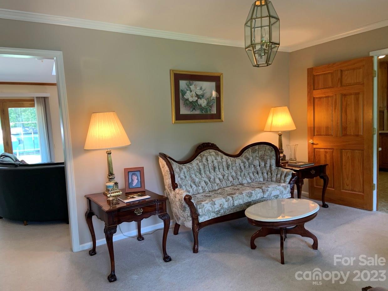 2403 Pinckney Road Chester, SC 29706 - Photo 3 of 19 a living room with furniture a lamp and a chandelier