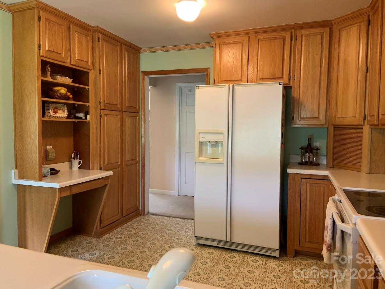 2403 Pinckney Road Chester, SC 29706 - Photo 7 of 19 a kitchen with stainless steel appliances granite countertop a refrigerator and a sink