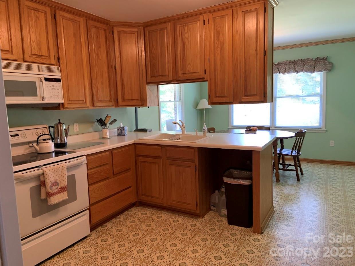 2403 Pinckney Road Chester, SC 29706 - Photo 8 of 19 a kitchen with a sink cabinets and window