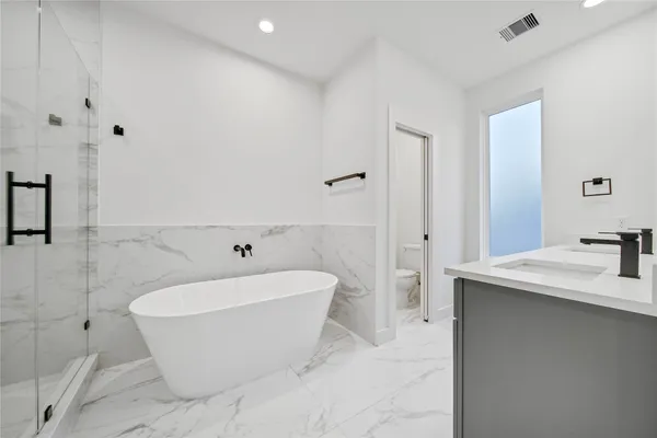 a white bath tub sitting in a bathroom