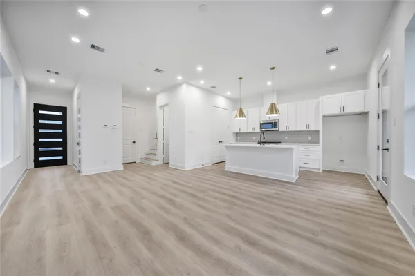 a view of kitchen with wooden floor