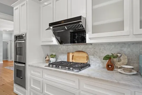 a kitchen with a stove and a microwave