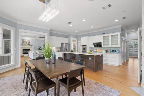 a kitchen with a table and chairs in it