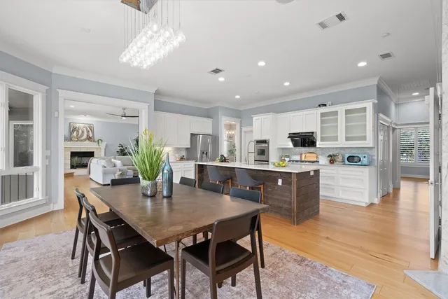 a kitchen with a table and chairs in it