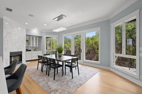 a view of a dining room with furniture window and outside view