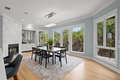 a view of a dining room with furniture window and outside view
