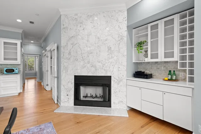 a kitchen with stainless steel appliances a oven and a fireplace