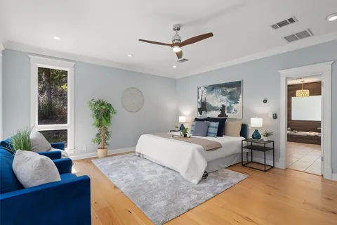 a bedroom with a large bed and a couch