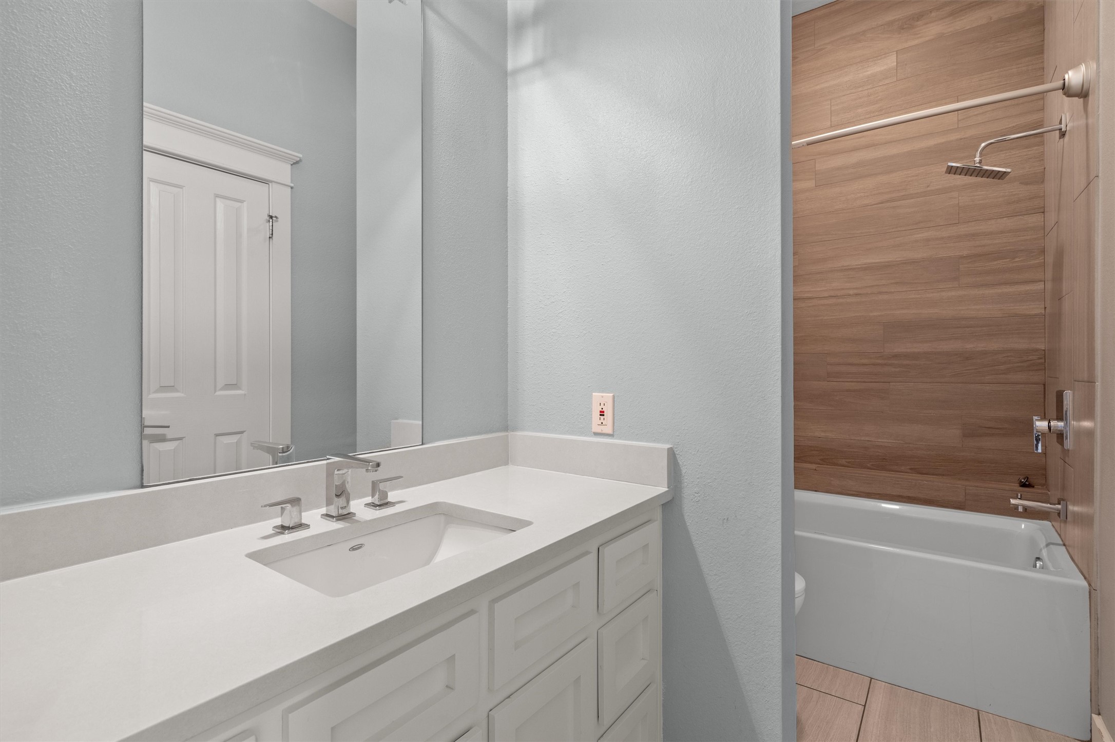 6405 Culpepper Cove Austin, TX 78730 - Photo 25 of 40 Bathroom featuring shower / bathtub combination, vanity, and a textured wall