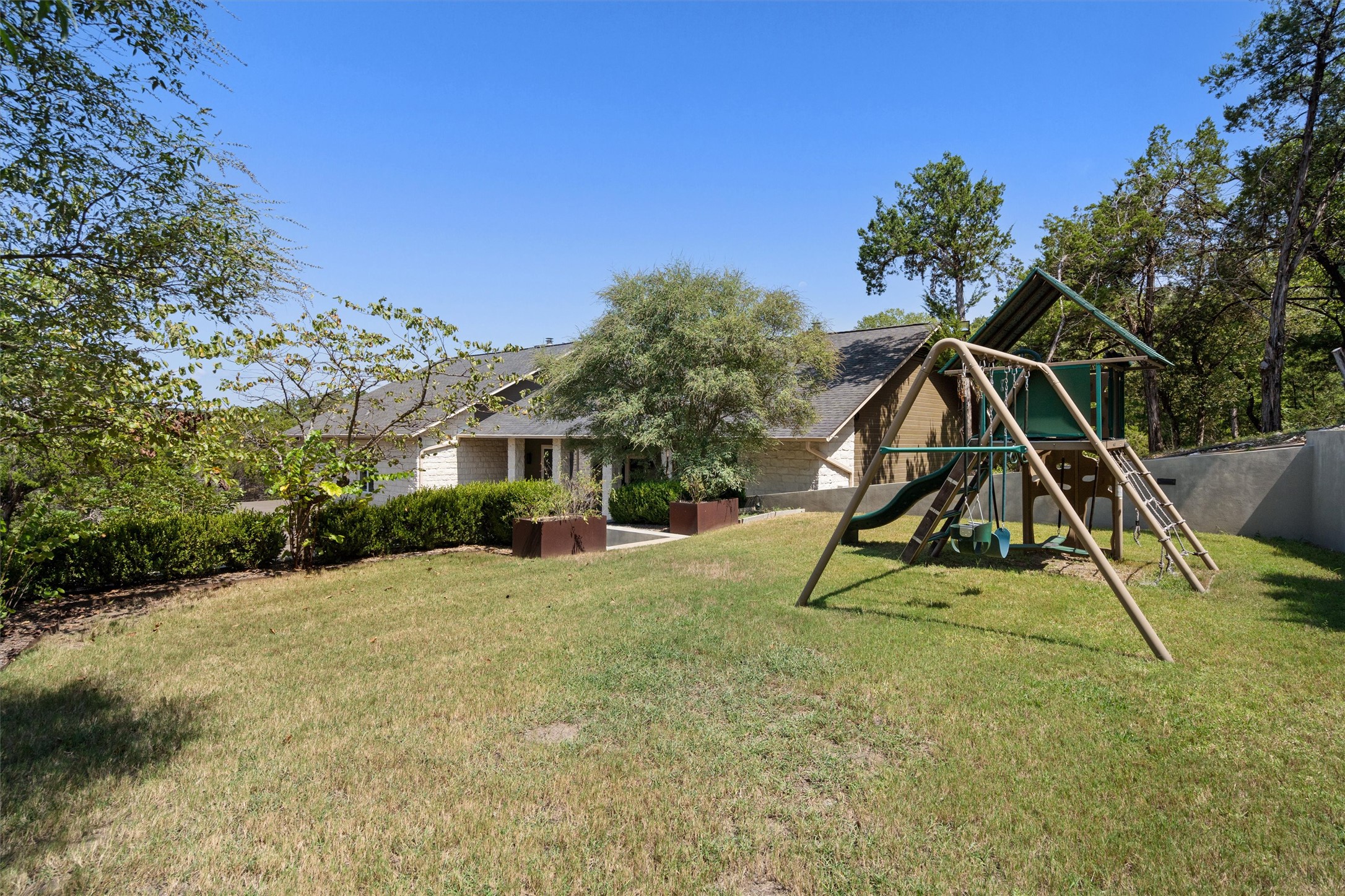 6405 Culpepper Cove Austin, TX 78730 - Photo 4 of 40 View of grassy yard featuring a playground