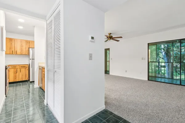 a view of a hallway with a bathroom