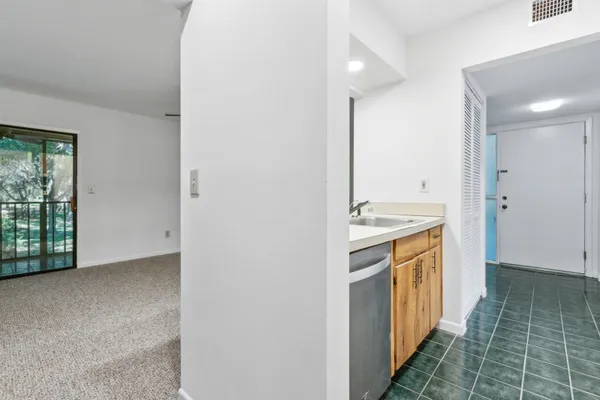 a view of a bathroom from the hallway