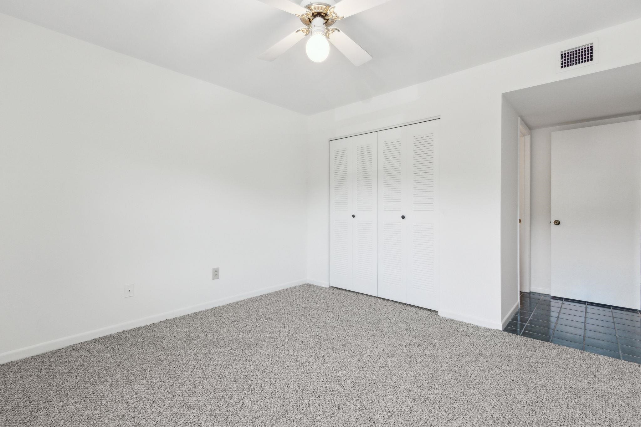 16 Alcira Court St. Augustine, FL 32086 - Photo 23 of 61 an empty room with a ceiling fan and a window