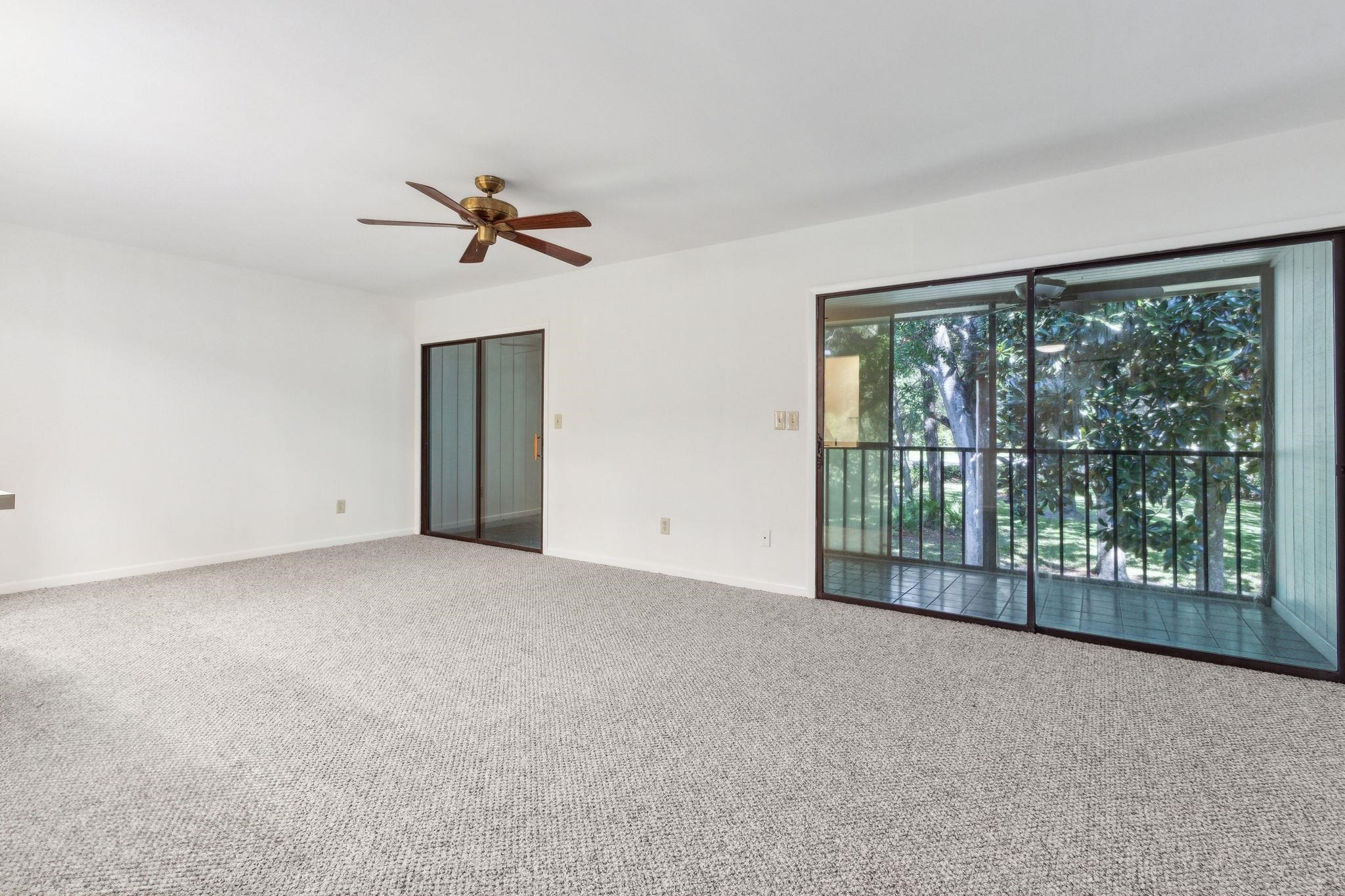 16 Alcira Court St. Augustine, FL 32086 - Photo 3 of 61 wooden floor in an empty room with a window