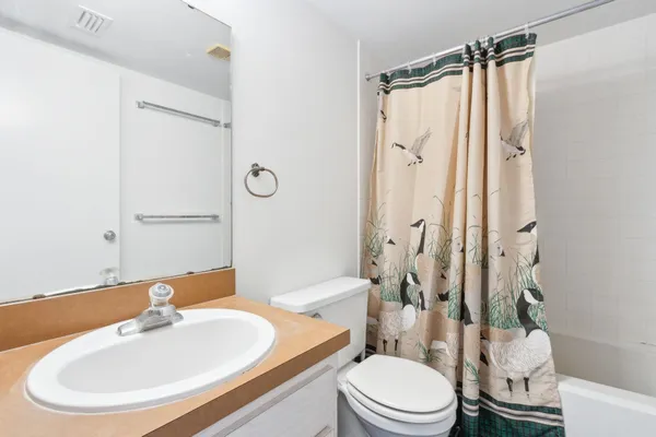 a view of a park bench under an umbrella