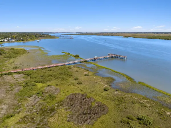 a view of a house with a backyard and garden