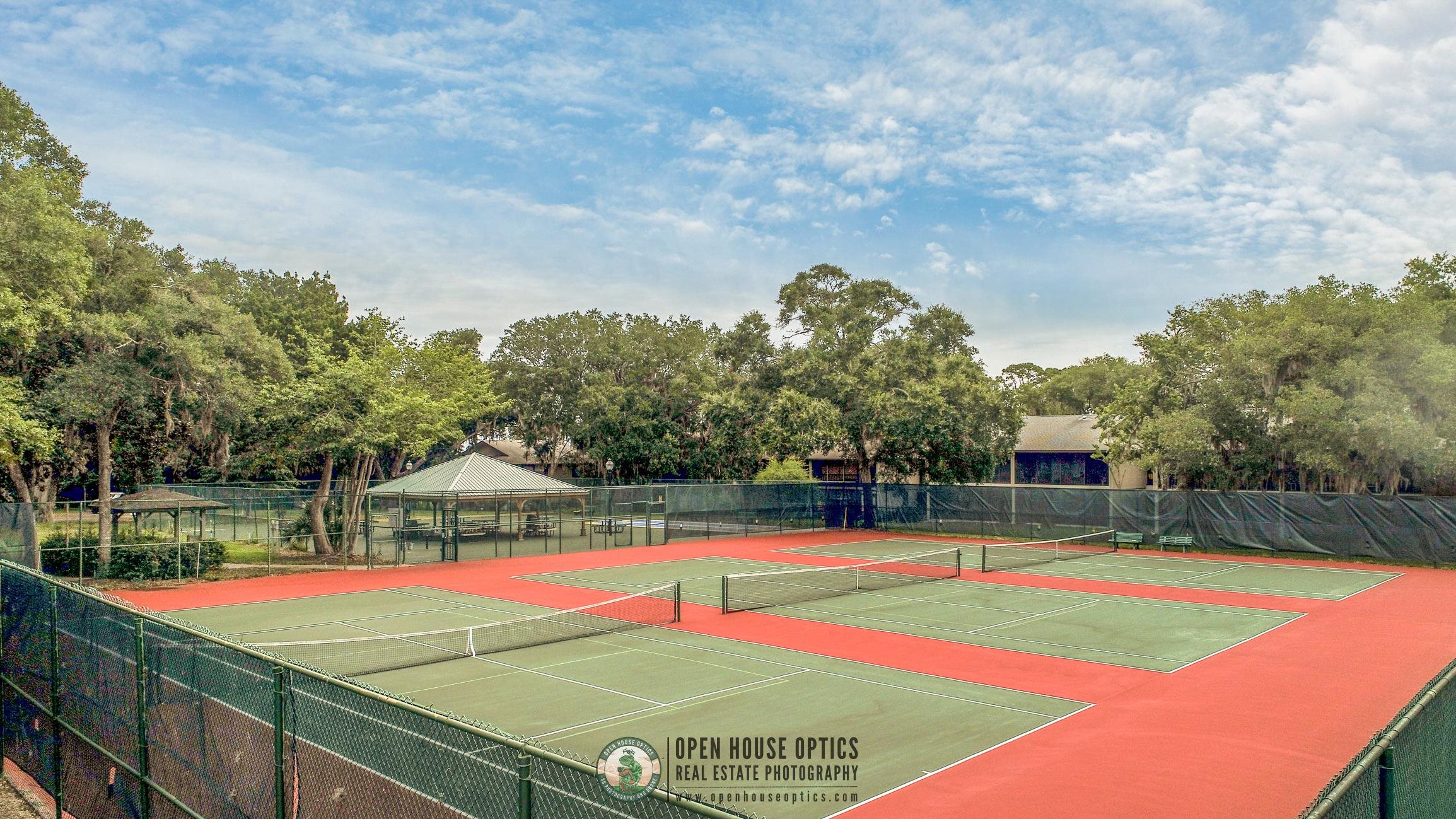 16 Alcira Court St. Augustine, FL 32086 - Photo 46 of 61 a view of a tennis ground with large trees