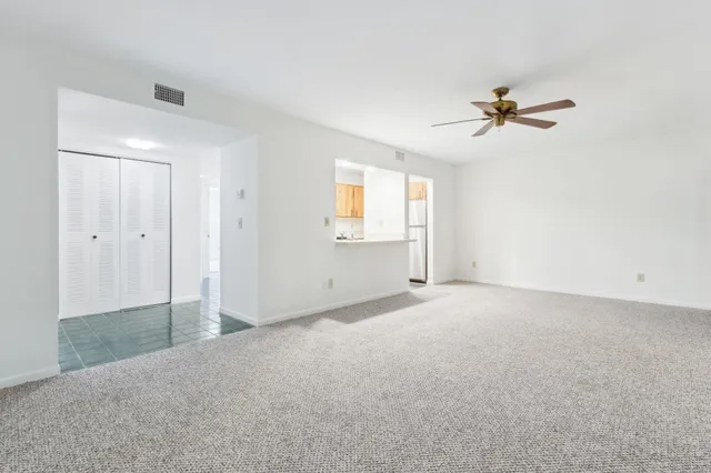 a view of empty room with windows