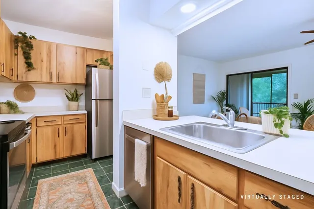 a kitchen with a sink and a refrigerator