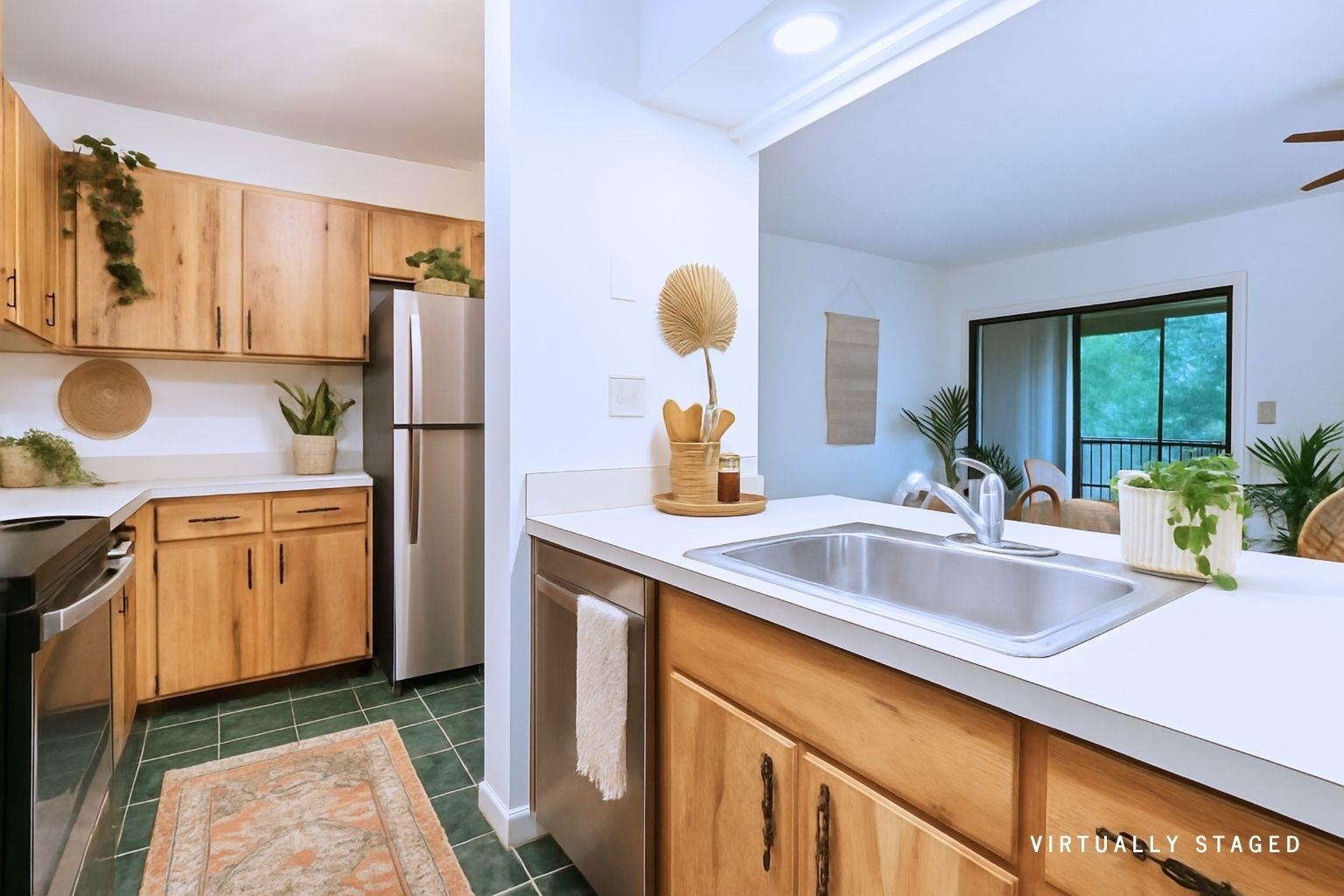 16 Alcira Court St. Augustine, FL 32086 - Photo 7 of 61 a kitchen with a sink and a refrigerator