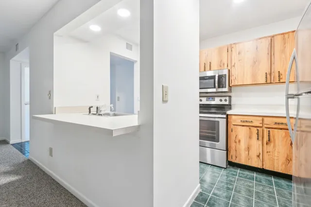 a bathroom with a sink a mirror and a window