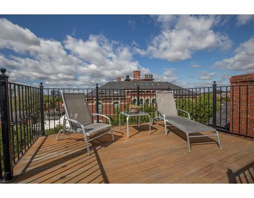44 Harvard Street Boston, MA 02129 - Photo 16 of 19 a view of a terrace with wooden floor and furniture