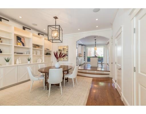 44 Harvard Street Boston, MA 02129 - Photo 7 of 19 a living room with furniture and a chandelier
