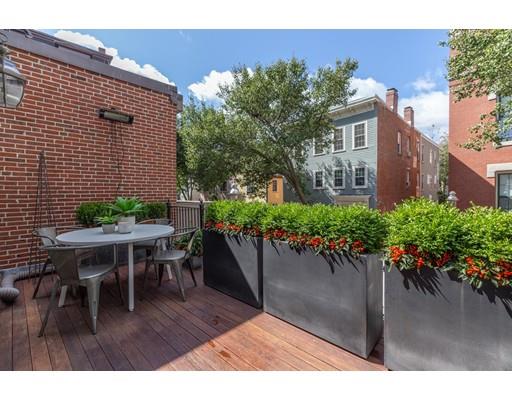 44 Harvard Street Boston, MA 02129 - Photo 9 of 19 a backyard of a house with outdoor seating