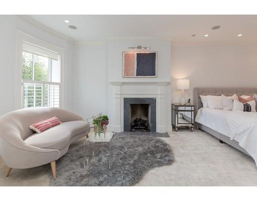 44 Harvard Street Boston, MA 02129 - Photo 10 of 19 a living room with furniture and a fireplace