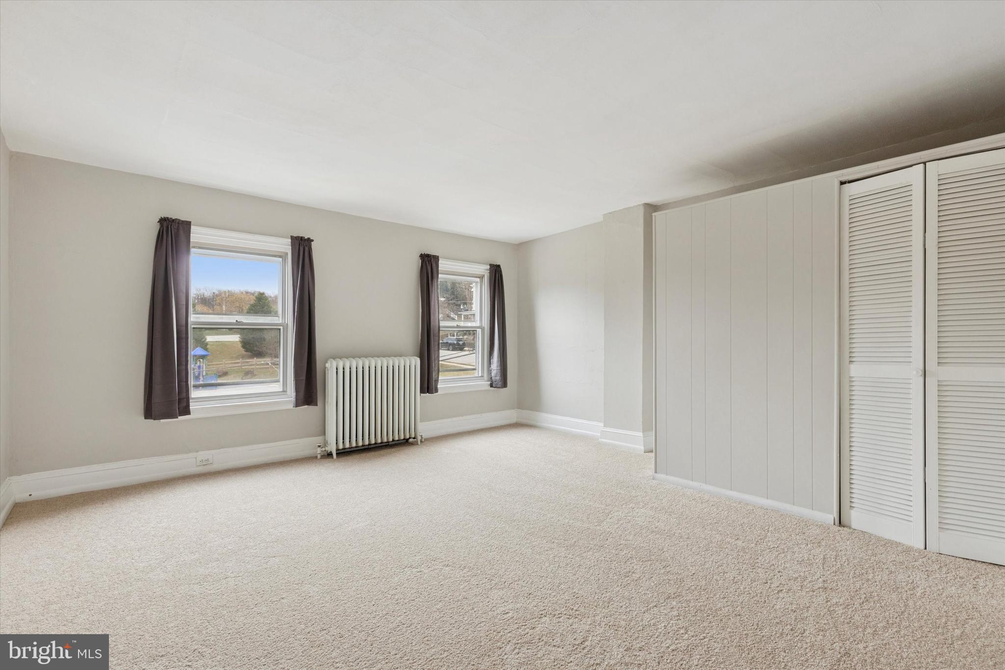 218 Bullock Avenue Conshohocken, PA 19428 - Photo 13 of 16 a view of an empty room with window and closet area