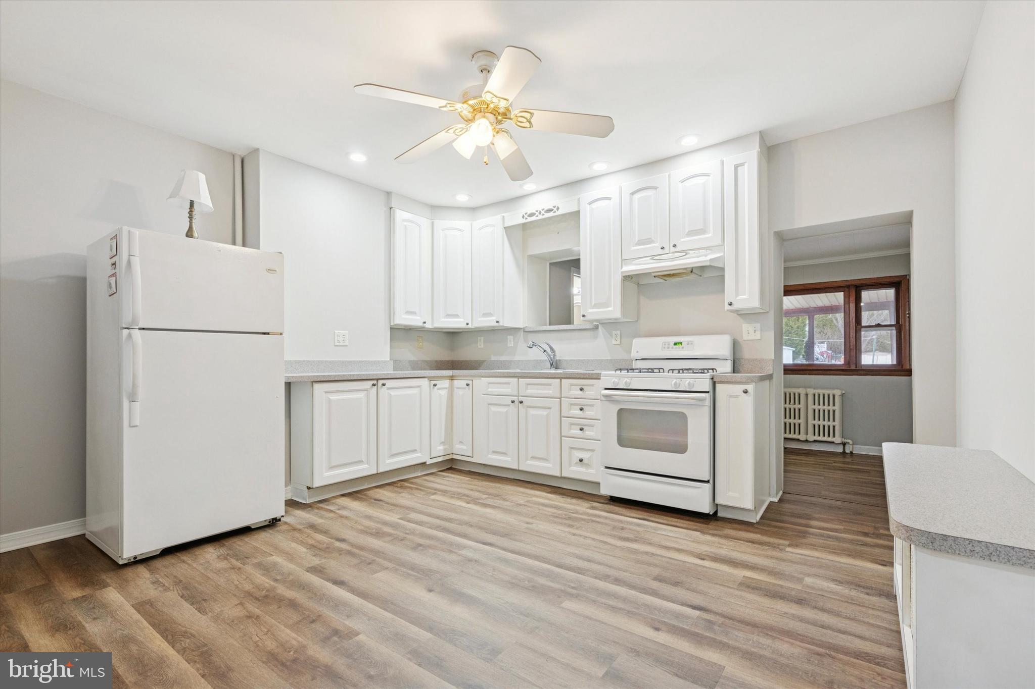 218 Bullock Avenue Conshohocken, PA 19428 - Photo 4 of 16 a kitchen with white cabinets and white appliances