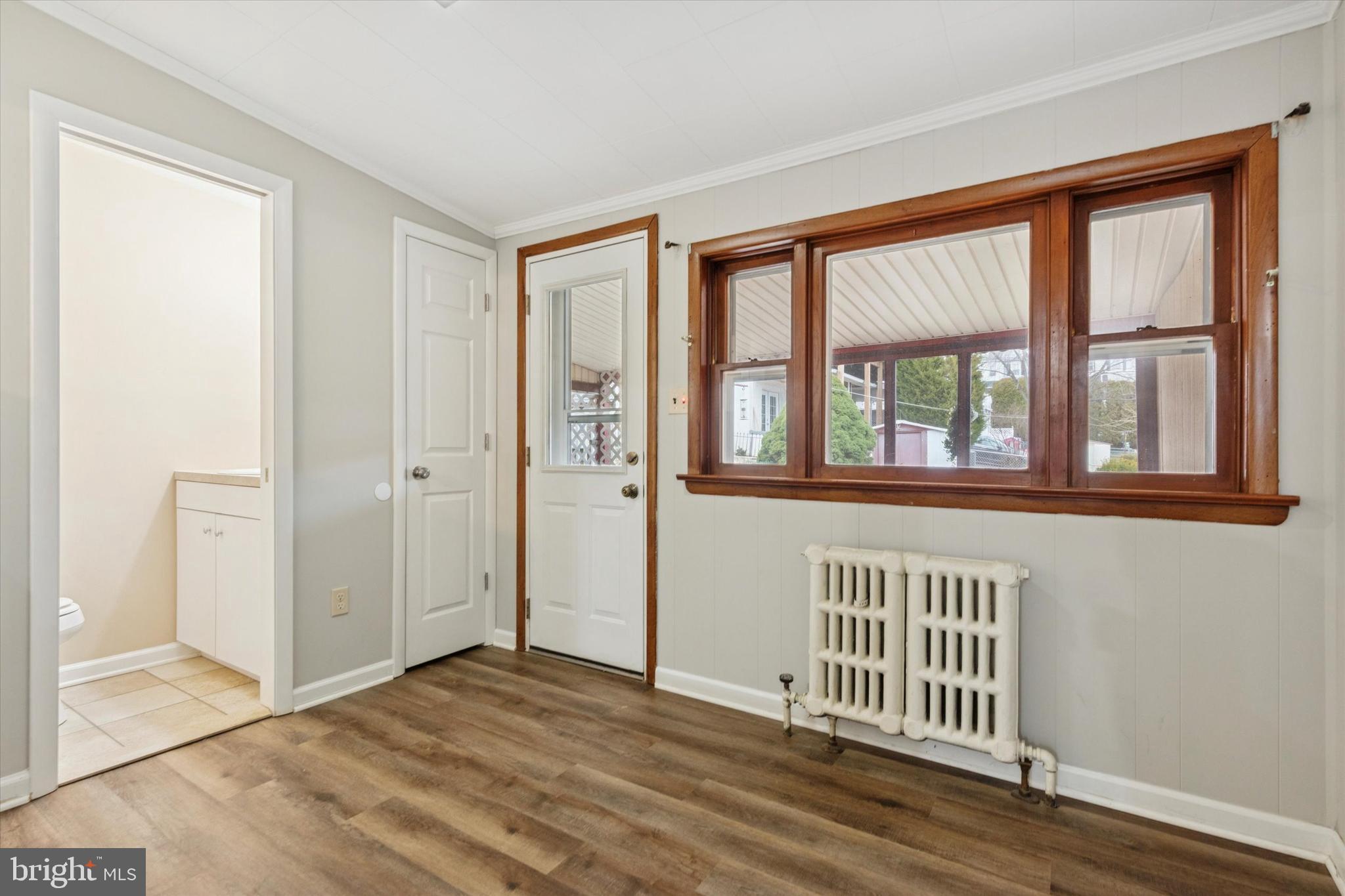 218 Bullock Avenue Conshohocken, PA 19428 - Photo 5 of 16 an empty room with wooden floor and windows