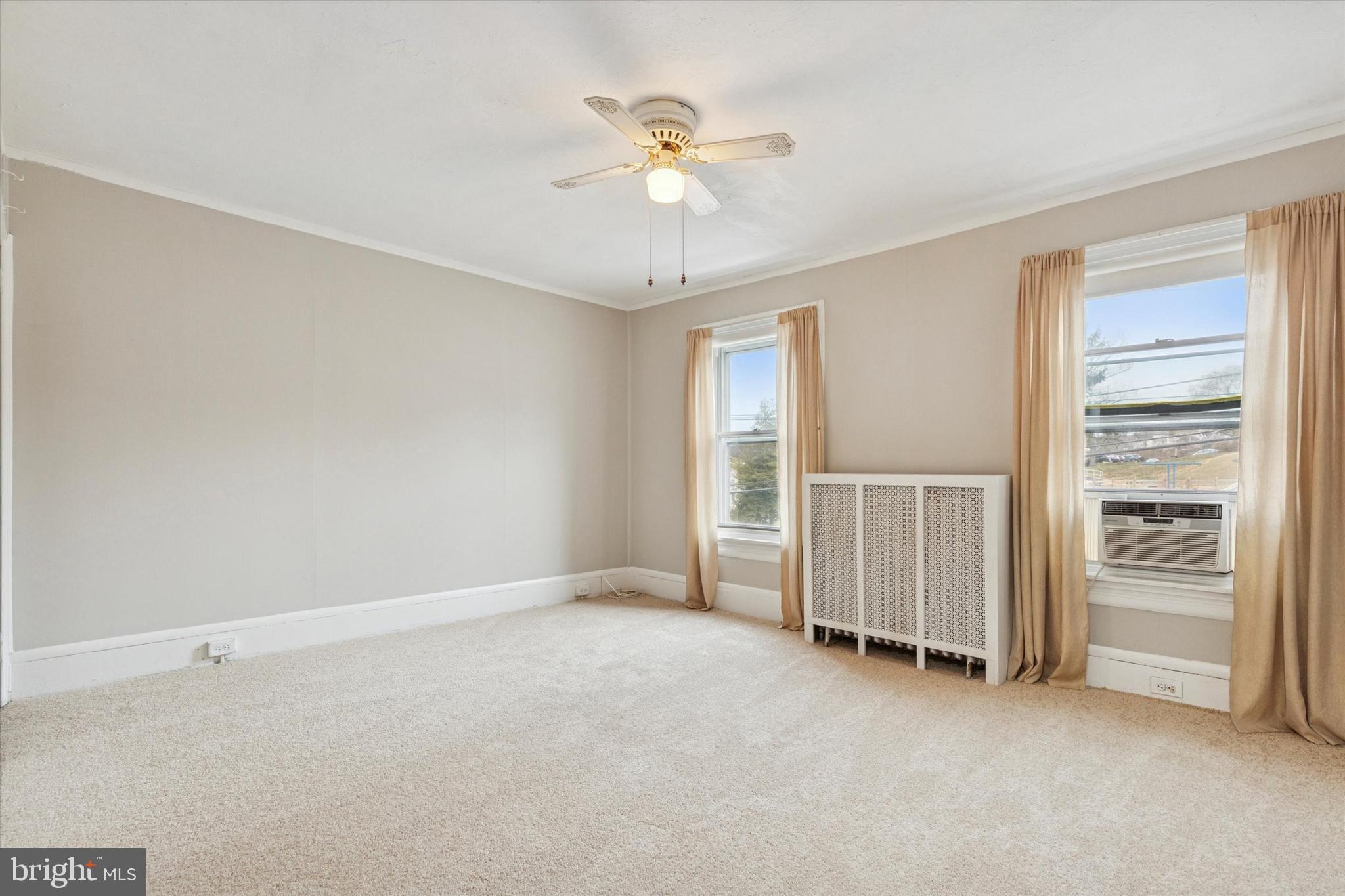 218 Bullock Avenue Conshohocken, PA 19428 - Photo 7 of 16 a view of an empty room with a ceiling fan